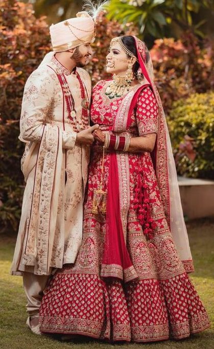 Wedding dress for bride and groom red lehenga choli ivory pink sherwani